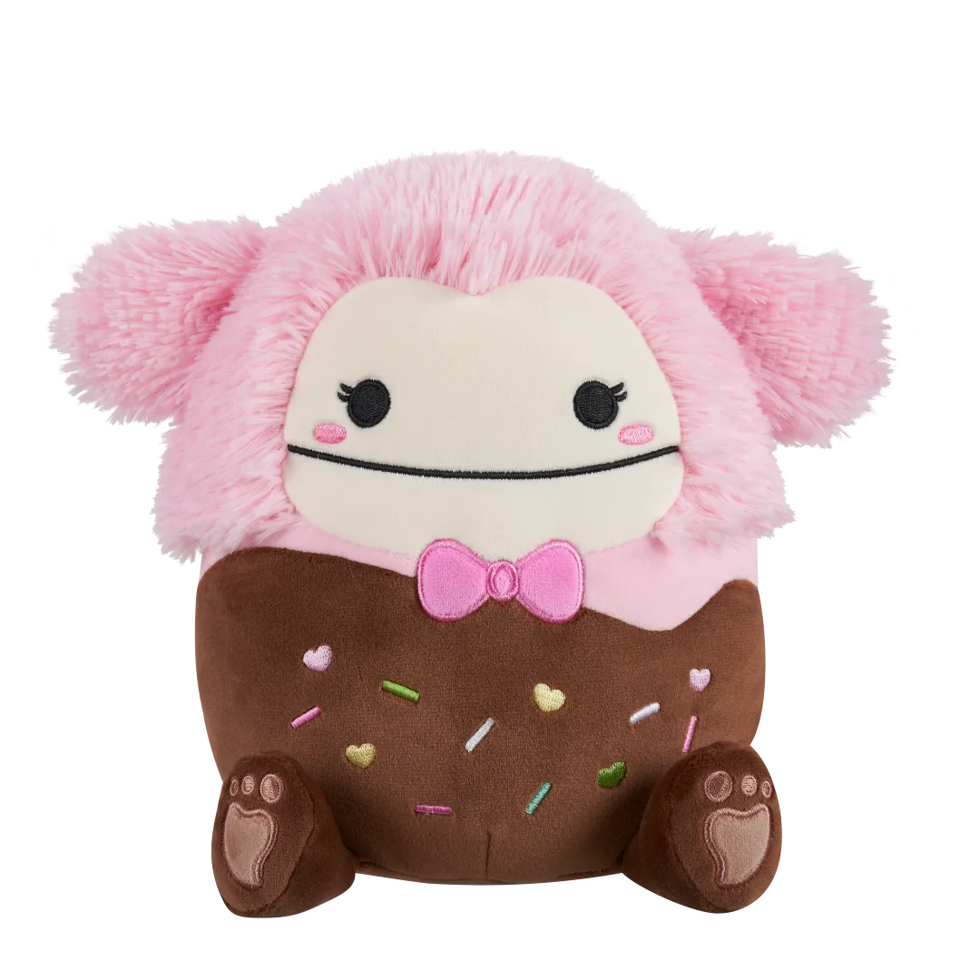 Squishmallows Brina de in chocolade gedoopte roze Bigfoot met roze strik, 20 cm